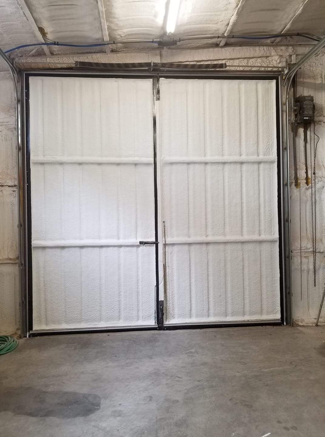 Insulated metal building with the overhead door closed