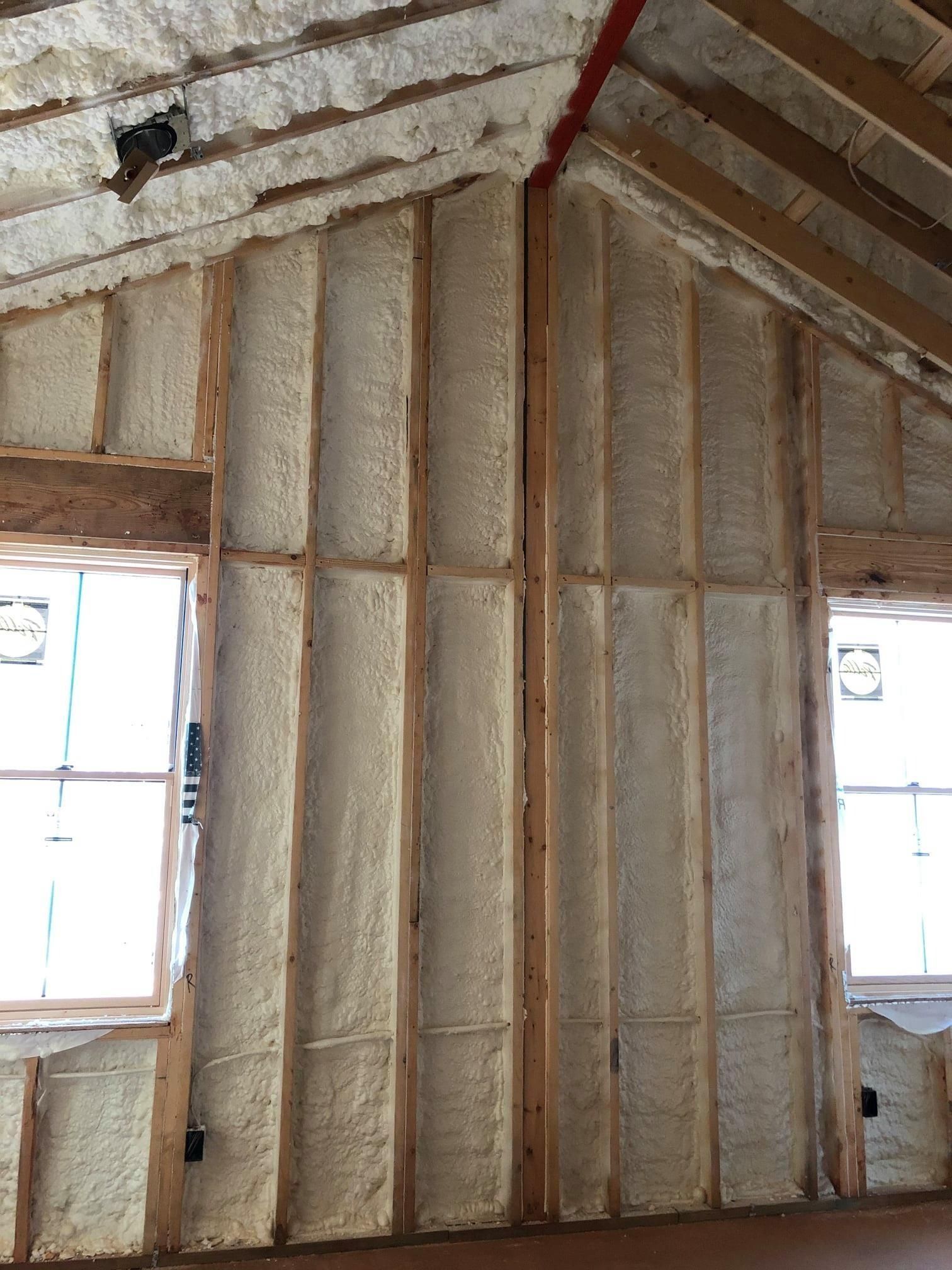 Spray foam insulation on a vaulted ceiling under construction