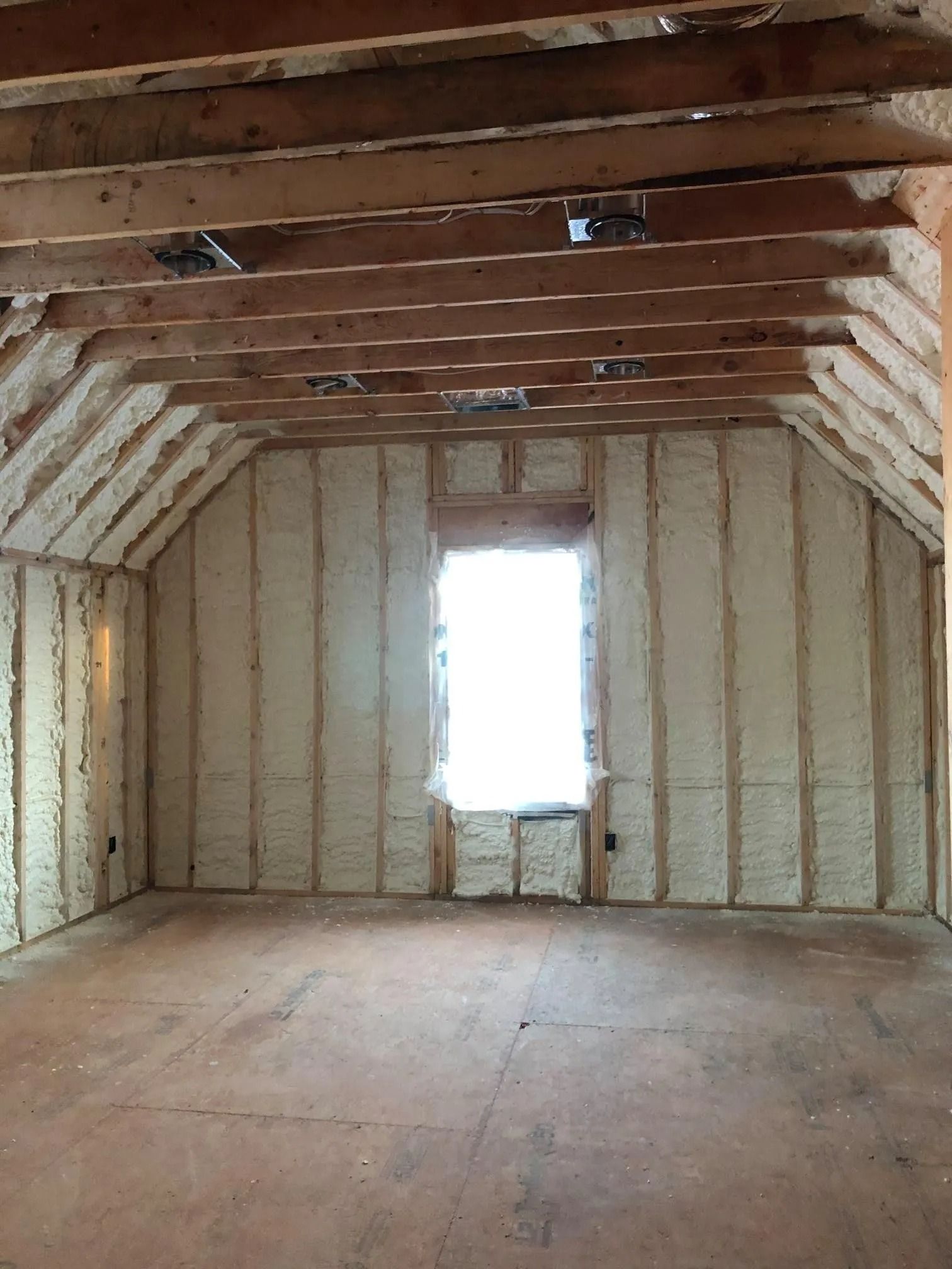 Attic framing insulated with spray foam in a Tennessee home