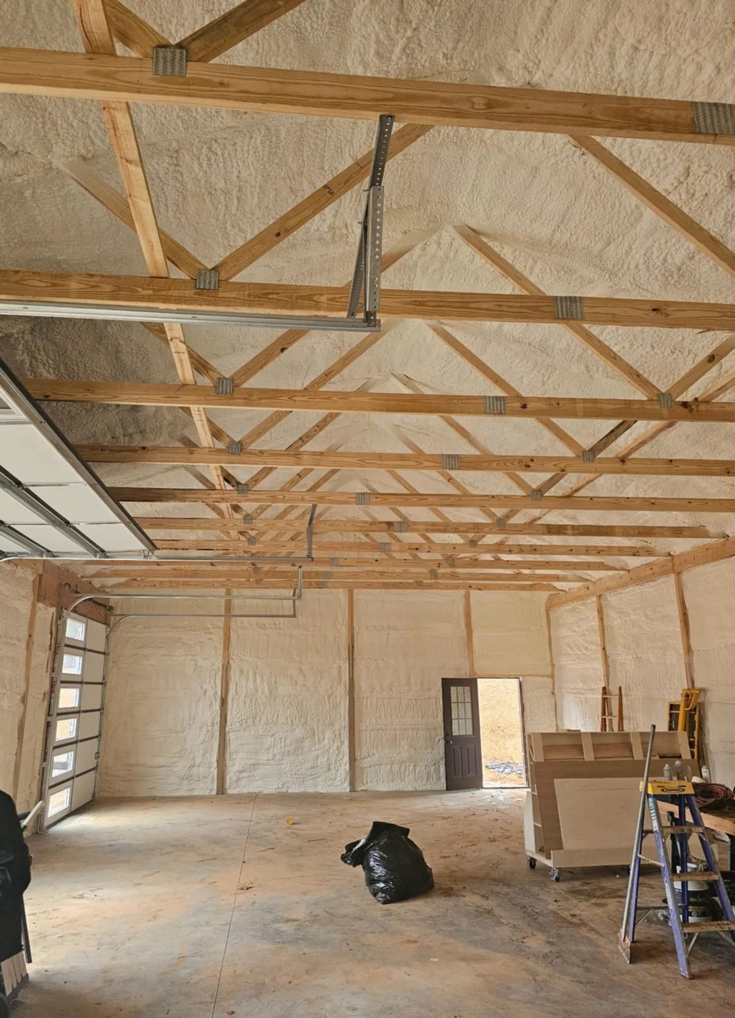 Roof framing insulated with spray foam in a new build
