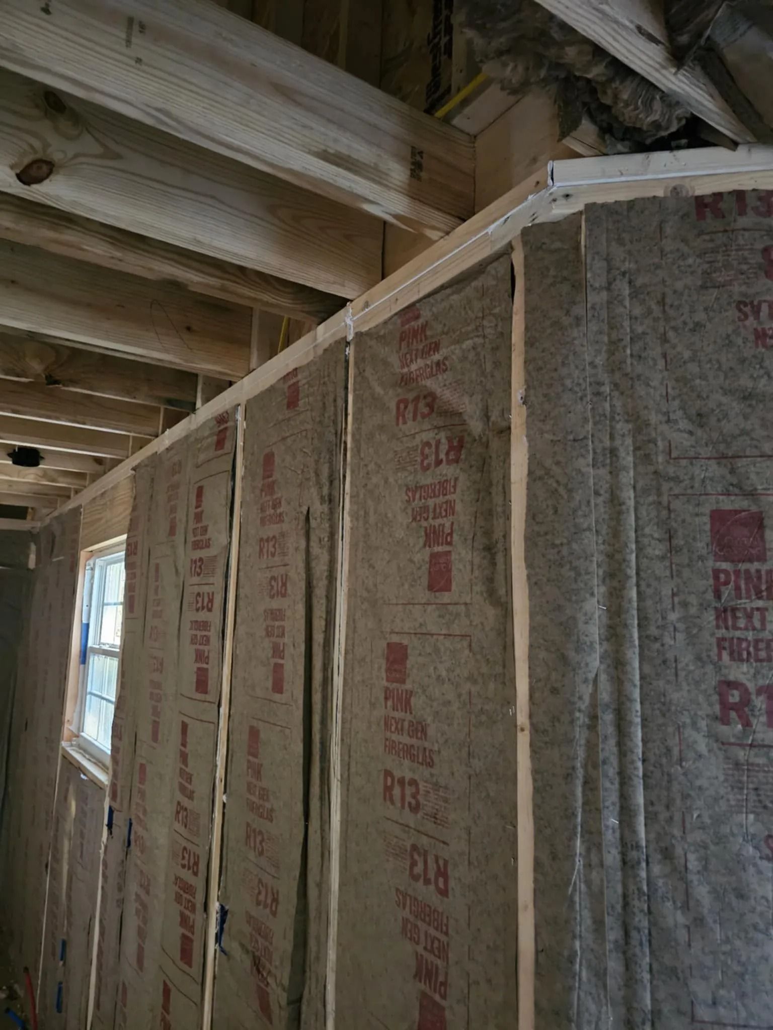 Interior wall insulated ahead of drywall installation