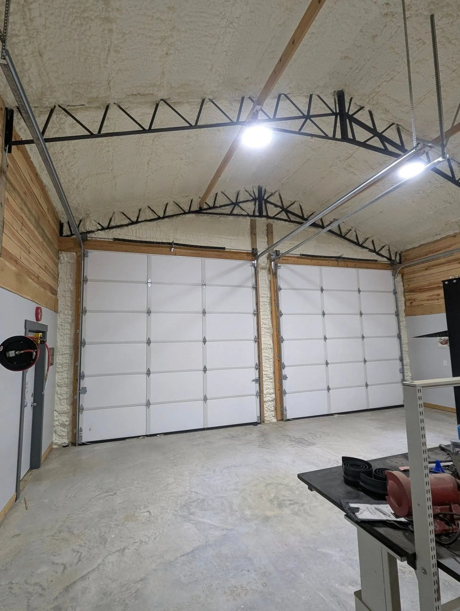 Finished spray foam insulation inside a shop building